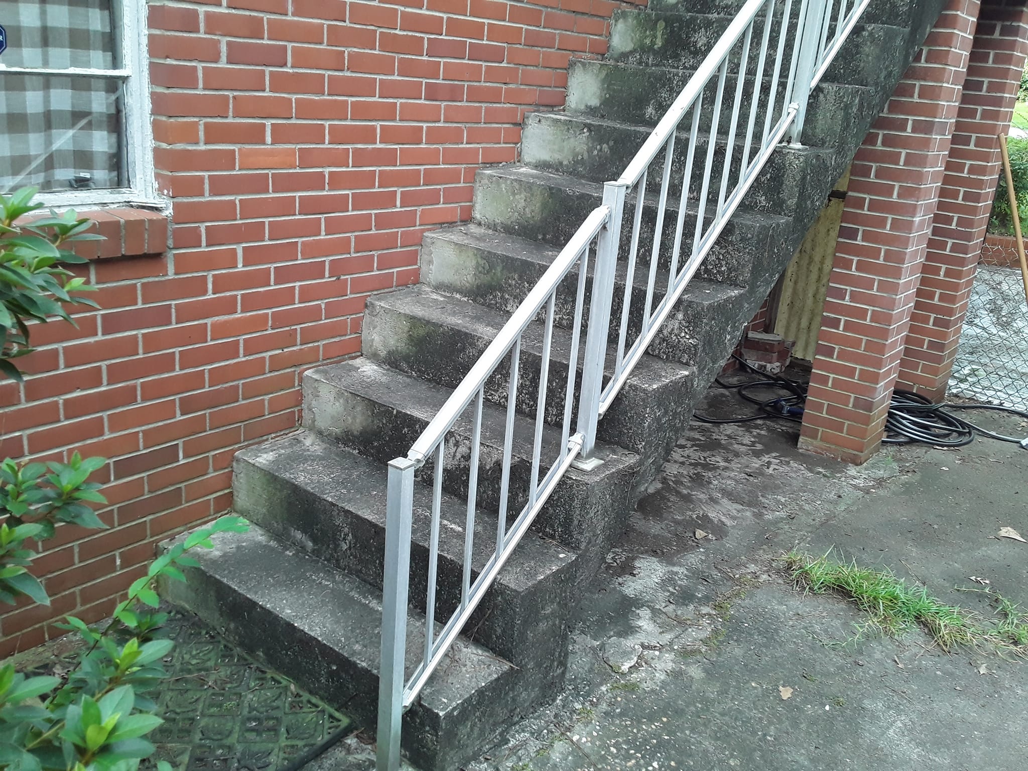 Dirty commercial stairs before pressure washing